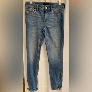 White House Black Market mid rise skinny ankle every soft jean with snake trim.